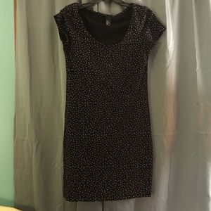 Black short sleeve dress with white polka dots.